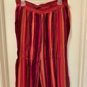 Wide legged pink and orange palazzo pants w/ gold accents.